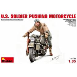 U.S. SOLDIER PUSHING MOTORCYCLE