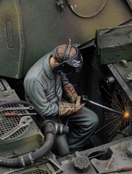 man using electric welder n°1