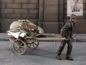 Evacuee pulling cart