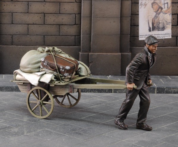 Evacuee pulling cart